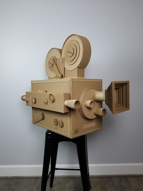 Vintage movie camera made of recycled cardboard. Handmade  by ©AlinesCardboard www.alinescardboard.com Cardboard Art Projects, Vintage Movie Camera, Cardboard Camera, Cardboard Art Sculpture, Deco Cinema, Cardboard Props, Cardboard Recycling, Cardboard Box Crafts, Cardboard Toys