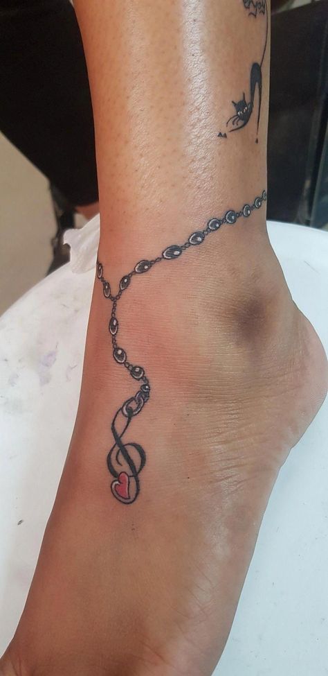 Ankle Tattoos For Women Anklet Ideas Charm Bracelets, Anklet Bracelet Tattoo, Anklet Tattoos For Women Chains, Ankle Charm Bracelet Tattoo, Anklet Tattoos For Women Unique, Chain Tattoos For Women, Anklet Tattoos Wrap Around, Ankle Chain Tattoo, Ankle Tattoos For Women Anklet