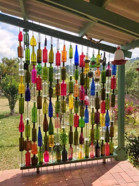 Easy Handmade Glass Bottle Garden Decorations - 150 Glass Bottle Ideas, Wine Bottle Garden, Upcycled Bottles, Porch Wall Decor, Hanging Candle Lanterns, Wine Bottle Wall, Backyard Oasis Ideas, Bottle Ideas, Easy Handmade