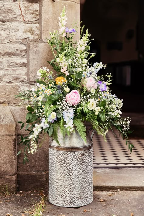 Milk Churn Wildflower Meadow Church Peony Fern Stock Daisy Festival Wedding Mismatched Country Camilla Lucinda Photography #wedding #MilkChurn #Wildflower #Meadow #Church #Peony #Fern #Stock #Daisy #Festival #Wedding Nikkah Flowers, Countryside Wedding Flowers, Rustic Church Wedding Decorations, Meadow Wedding Flowers, Wedding Flower Urns, Wedding Flower Meadow, Meadow Style Wedding Flowers, Church Flowers Wedding, Milk Churn Wedding Flowers