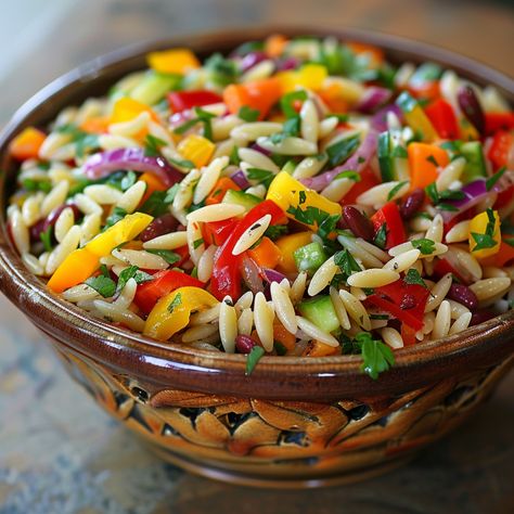 Rainbow Orzo Salad is a delightfully vibrant and fresh dish that�’s filled with a colorful mix of vegetables and a zesty dressing. It’s not heavy or overly rich either. I think it’s a perfect summertime or picnic salad, and if you’re not a fan of any particular vegetable, feel free to omit it. It will still be undeniably delicious! If you’re looking for a light & colorful salad that’s not overly complicated, you’ve come to the right place. When you combine tender orzo with a medley of crisp ... Harvest Orzo Salad, Picnic Salad, Colorful Salad, The Perfect Salad, Fresh Dishes, Perfect Salad, Lunch Appetizers, Orzo Salad, Summer Corn Salad