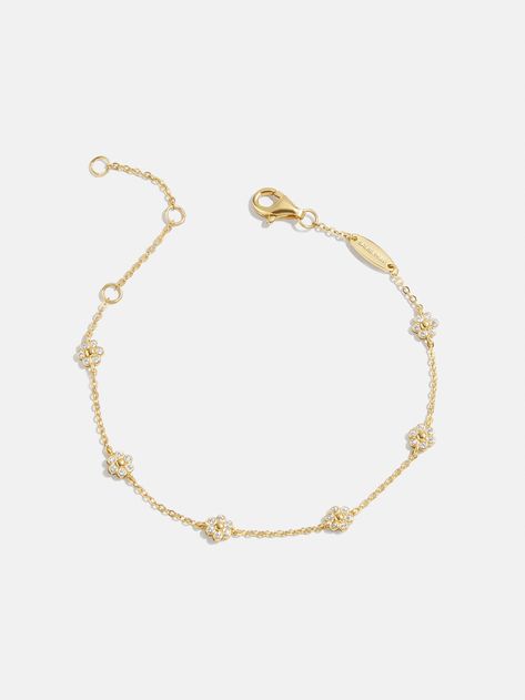 Never underestimate the power of subtle flowers. Embodying the sweetness of daisies, the Daisy 18K Gold Bracelet features an 18K gold plated sterling silver chain with interspersed Cubic Zirconia flower embellishments. It's even polished off with an adjustable extender, so you can ensure the perfect fit.