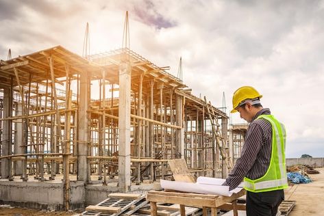 Premium Photo | Young business man professional engineer worker at the house building construction site with blueprint Construction Loans, Red Bluff, Future Buildings, Construction Firm, Bungalow House Plans, Beautiful Houses, Bungalow House, Building A New Home, Real Estate Development