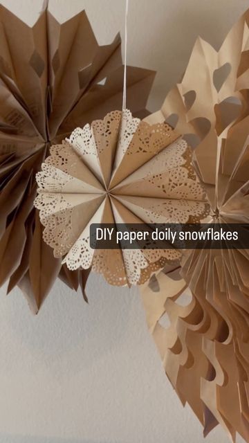 Misfit Mama on Instagram: "A holiday craft that doesn’t require scissors! ✂️ ⠀⠀⠀⠀⠀⠀⠀⠀⠀ I found kraft paper doilies (4 inch & 6 inch) on Amazon and used the glue sticks we had on hand. ⠀⠀⠀⠀⠀⠀⠀⠀⠀ Folding each doily the SAME size is key! That’s why I stacked them and folded together first. ⠀⠀⠀⠀⠀⠀⠀⠀⠀ I used 8 doilies per snowflake. ⠀⠀⠀⠀⠀⠀⠀⠀⠀ Save this + tag me in your stories when you give it a try! ❄️ ⠀⠀⠀⠀⠀⠀⠀⠀⠀ ⠀⠀⠀⠀⠀⠀⠀⠀⠀ #holidaydecor #holidaydecorating #diysnowflakes #letitsnow #homeschoolcrafts" Paper Doily Stars, Doily Garland Diy, Snowflakes Made From Paper Doilies, Paper Dollies Christmas Crafts, Paper Doily Snowflakes Diy, Doilie Snowflakes, Doily Snowflakes Diy, Paper Doily Crafts Christmas, Paper Doily Snowflakes