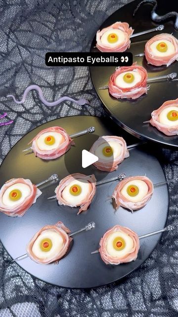 Genevieve LaMonaca on Instagram: "Antipasto Eyeballs 👀 Follow @chefgenevieve for 50 Halloween inspired recipes. Who’s making these?

Ingredients:

8oz Ciliegine (cherry sized) mozzarella balls 
12 Pimento stuffed Manzanilla olives 
12 slices prosciutto 

Directions:

Add mozzarella balls to a bowl and cover with hot water (about 185°F) Allow to sit for 3 minutes to warm the mozzarella enough to shape. 

Use two balls to form into 1 larger ball. While still warm, shape into a smooth round ball. Poke a hole in the center using your pinky finger then push in an olive. 

Cut prosciutto into 4 long strips and wrap around the mozzarella eyeball. Secure with a skewer

Enjoy! 👻

#antipastoeyeballs #halloweenfood #halloweeninspo #edibleeyeballs #halloweenfoodinspo" Stuffed Eyeballs, Halloween Skewer Ideas, Antipasto Eyeballs, Mozzarella Eyeballs, Eyeball Food, Halloween Food Crafts, Edible Eyes, Somebody's Watching Me, Mozzarella Balls