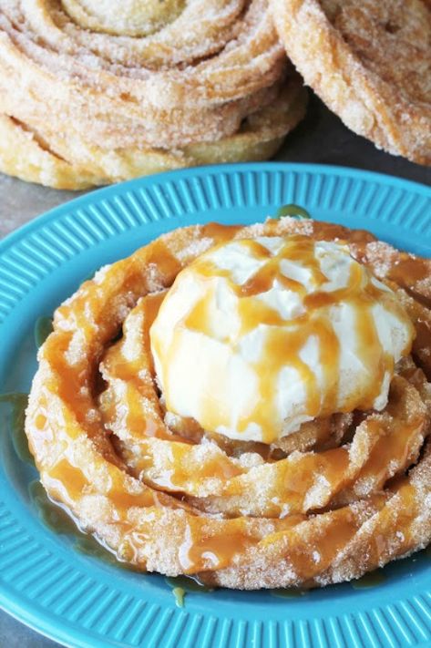 Disneyland’s Delicious Churro Funnel Cakes. Spiral churro goodness topped with freshly whipped cream and drizzled with caramel sauce. | Copycat Disney Recipes on Frugal Coupon Living. #disney #disneyrecipes #disneyland #disneyworld #copycatrecipe #copycat #DisneyFood #recipes Homemade Funnel Cake, Disney Dishes, Funnel Cake Recipe, Funnel Cakes, Disney Recipes, Carnival Food, Fair Food, Cake Bites, Lobster Recipes