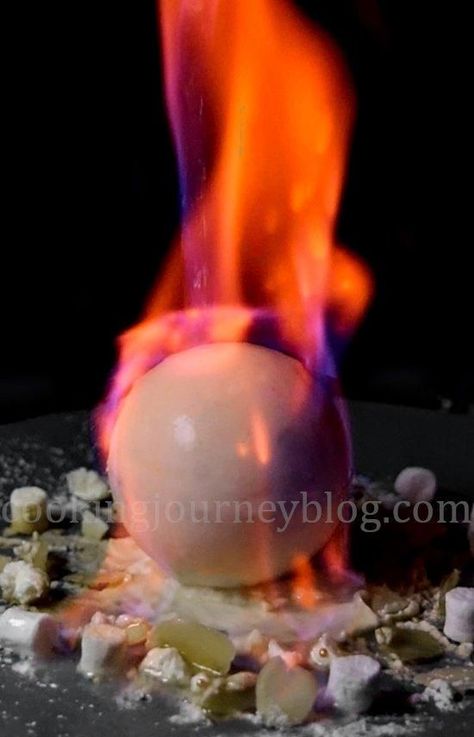 Flaming Chocolate Ball. Easy winter dessert, melting chocolate. Great dessert for holidays, light up Christmas! #dessertrecipes #christmasdesserts #snowballs Melting Chocolate Ball Dessert, Flaming Desserts, Easy Winter Dessert, Fire Desserts, Flambe Desserts, Modern Desserts, Chocolate Balls Recipe, Winter Desserts Easy, Easy Christmas Desserts