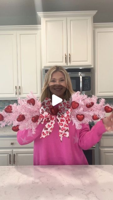 Laura Jeanne on Instagram: "Make this Valentine Swag for only $5.00!!! And everything you see is from Dollar Tree ♥️ You’ll need 2 pink trees, ribbon, and Valentine picks or mini ornaments.  I used floral wire and hot glue to connect the two trees and then used hot glue to adhere the hearts to the tree.  Just add your bow and voila!! #valentines #valentinesday2024 #valentinesdecor #foryoupagereels #foryourpage" Valentines Decorations Diy, Valentine Swag, Heart Wreath Diy, Valentine Day Table Decorations, Hanger Christmas Tree, Diy Valentines Day Wreath, Valentine Wreath Diy, Valentine Door Decorations, Diy Tree Decor