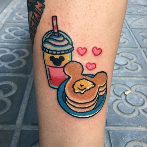 Disney latte and pancake tattoo Pancake Tattoo, Dessert Tattoo, Kawaii Tattoos, Cartoons Tattoo, Patchwork Tattoos, Disney Sleeve Tattoos, Collarbone Tattoo, Traditional Patchwork, Food Tattoos