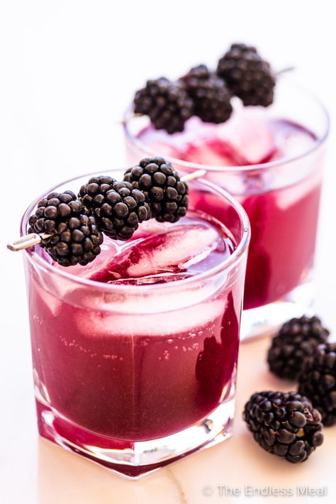 Fresh blackberries simmered in culinary lavender make an aromatic syrup for this blackberry lavender soda. The heavenly combination of fruity and floral flavors captures summertime in an ice-cold drink. It's quick and easy to make at home and extra syrup can be stored in the fridge for up to a week! #theendlessmeal #blackberrysoda #lavendersoda #lavender #blackberry #blackberries #soda #drink #summer #summerdrink #blackberrysyrup Blackberry Lavender, Halloween Recipes Drinks, Sidecar Cocktail, Lime Lemonade, Blackberry Syrup, New Years Eve Dinner, Culinary Lavender, Halloween Drinks, Gin Tonic