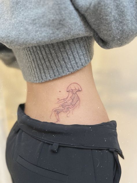 Hip Jellyfish Tattoo, Hip Tattoo Jellyfish, Jellyfish Tattoo On Hip, Red Ink Jellyfish Tattoo, Aesthetic Jellyfish Tattoo, Tattoo Ideas Female Jellyfish, Jellyfish Stomach Tattoo, Minimal Jellyfish Tattoo, Two Jellyfish Tattoo