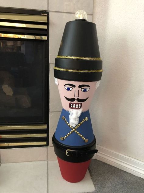 How to DIY a Christmas Nutcracker from Flower Pots | Hometalk Plant Character, Diy Nutcracker, Elf Party, Nut Crackers, Paint Face, Flower Pot People, Pot People, Nut Cracker, Winter Decorations Diy