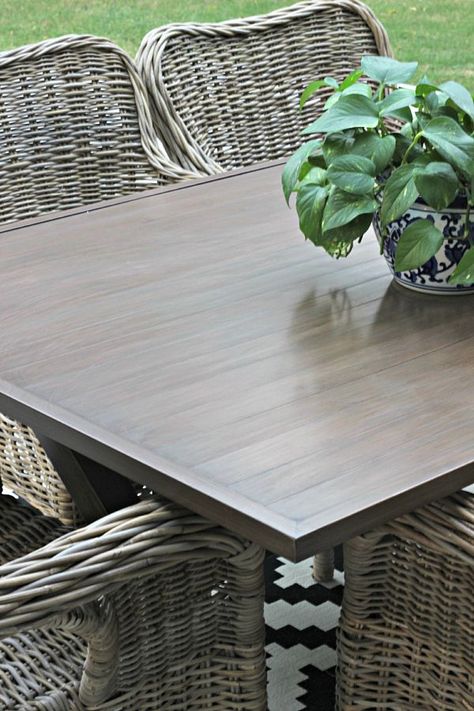 Outdoor metal wood grain finish table makeover with gel stain Refinish Outdoor Furniture Metal, Refinish Outdoor Table, Refinish Metal Patio Furniture, Metal Patio Table Makeover, Patio Table Makeover, Metal Patio Table, Porch Projects, Real Wood Table, Metal Outdoor Table