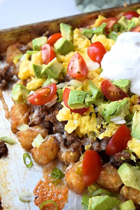 Breakfast Totchos = Golden tater tots, smothered in melted sharp cheese & loaded with scrambled eggs, sausage, and other toppings. Breakfast Nachos Tater Tots, Loaded Breakfast Tots, Nacho Tater Tots, Breakfast Totchos Recipe, Tater Tot Breakfast Bowl, Breakfast Tater Tots, Denver Scramble, Breakfast Totchos, Totchos Tater Tots