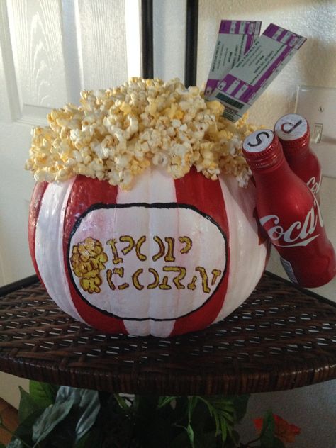 Made from an uncarved pumpkin. I used acrylic paints, printed out fake movie tickets, added two miniture coke cans and hot glued on popcorn. I used tape to help me achieve straight lines Book Character Pumpkin, Book Character Pumpkins, Halloween Pumpkin Crafts, Creative Pumpkin Decorating, Character Pumpkins, Fall Carnival, Pumpkin Decorating Contest, Pumpkin Contest, Halloween Pumpkin Designs