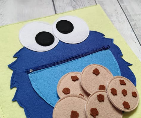 "Monster eating cookies. You can buy one page and use it as a separate game or buy several pages and combine them into a quiet book. You can match and mix pages to make your own quiet book. You can view pages here: https://www.etsy.com/shop/FetrikShop?ref=seller-platform-mcnav&section_id=26097224 If you want to create an individual page, just message me. SET OPTIONS Quiet book page consisting of ONE page. SIZE The size of the board is 8″x8″ (20x20cm) AGE RECOMMENDATIONS For children from 1 t Busy Book Diy, Quiet Book Activity Pages, Baby Busy Book Diy, Quiet Book Pages, Felt Busy Book, Busy Book Ideas, Quiet Book Ideas, Toddler Busy Book, Diy Quiet Book