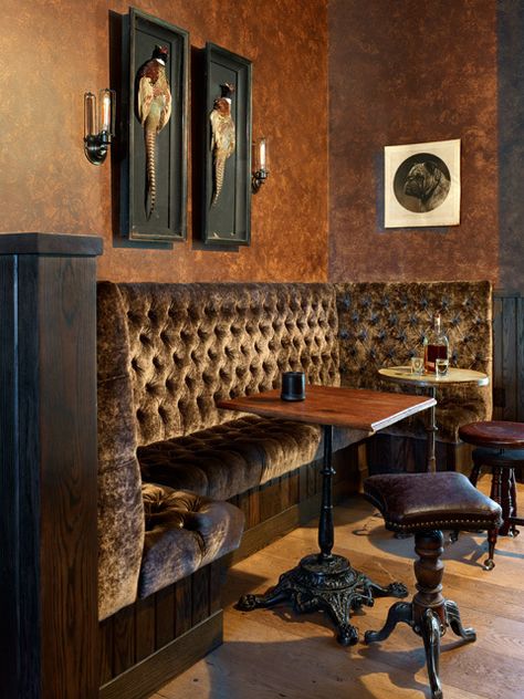 The bar area adjacent to Tasting Room channels a storied speakeasy vibe. The mix of Victorian piano stools and Victorian pub tables adds a sense of authentic character, and Wick’s custom-designed wall sconces complete the theme. Speakeasy Seating, Home Speakeasy Bar, Speakeasy Bar Design, 20s Speakeasy, Speakeasy Ideas, Speakeasy Decor, Pub Ideas, Pub Interior, Speakeasy Bar