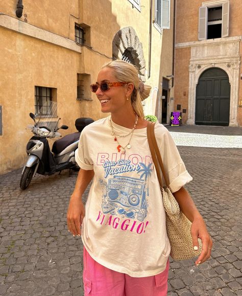 The Buon Viaggio tee on vacay in Rome with @amanda_mckinzie 💗🩵💖 Online in less than two days! ⏰ August Style, Oversize Tee, Oversized Spring Vacation Shirt, Oversized Summer Vacation Shirt, Oversized Summer T-shirt For Vacation, T Shirt Aesthetic, Vacation Graphic Print Tee, Oversized Graphic Print T-shirt For Vacation, Surf Girl Style