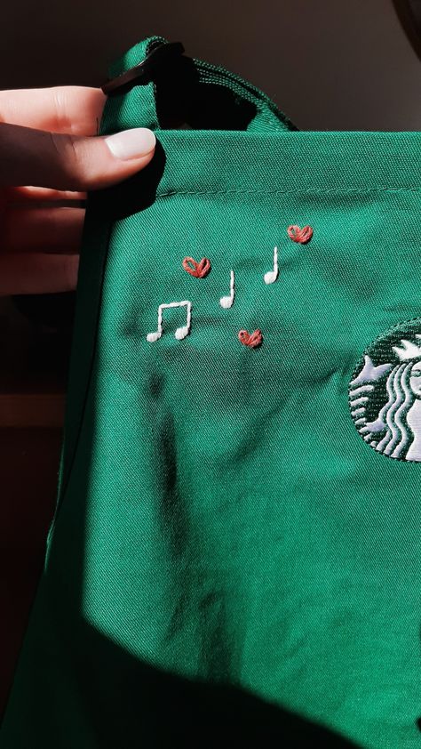 Customized Starbucks apron custom hand embroidery embroidered calligraphy simple minimalist tiny music notes design • jasper rose co Musical Notes Embroidery, Starbucks Apron Embroidery, Music Notes Embroidery, Embroidery On Apron, Hand Embroidery Tshirt Ideas, Sweater Embroidery Ideas Simple, Music Embroidery Designs, Apron Embroidery Ideas, Starbucks Embroidery