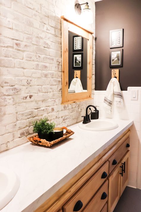 When we made over the boys bathroom, I knew I wanted a showstopper. Here's how to install and limewash brick veneer accent wall. Faux Brick Wall Bathroom Master Bath, Faux Brick Wall Bathroom Ideas, Brick Tiled Bathrooms, Whitewash Brick Bathroom, Shiplap And Brick Bathroom, Faux Brick Wall In Bathroom, Painted Brick Bathroom Wall, Brick Veneer Wall Kitchen, Brick And Shiplap Wall Bathroom