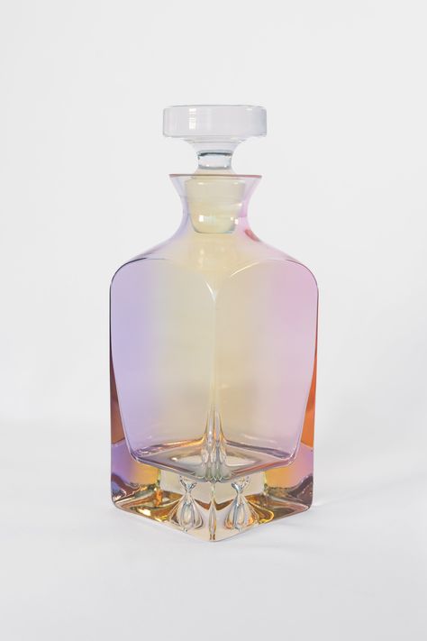 - Made by glass artisans in Poland - One piece- Dimensions: 8.5 inches tall x 4 inches wide- Capacity: 26 ounces- Care Instructions: Hand wash only. - PRE-ORDER: Expected to ship by the end of November  The founder of Estelle Colored Glass has named the collection in honor of her grandmother, Estelle, who she describes Colorful Bottles, Beautiful Bottles, Glass Crystal, Iridescent Glassware, Glass Color, Cool Bottles, Aesthetic Glass, Glass Bottle, Glass Bottle Decor