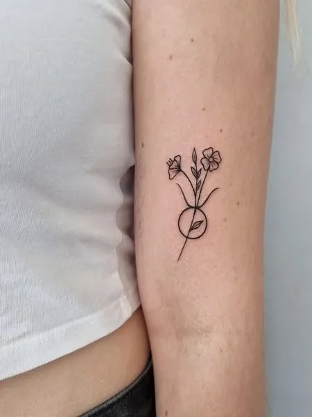 Small Taurus Tattoo Taurus Small Tattoo For Women, Womens Taurus Tattoo, Taurus Wildflower Tattoo, Back Tattoo Taurus, Flower Taurus Tattoo, Lily Of The Valley Taurus Tattoo, Taurus Wrist Tattoo, Taurus Line Tattoo, Taurus Floral Tattoo