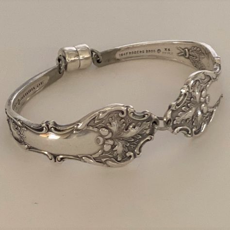 A beautiful handmade spoon bracelet created by recycling two matching antique silver plate spoons - the perfect gift for bridesmaids, weddings, for her or for mom.  Charter Oak is a pattern that was produced by 1847 Rogers in 1906, extremely collectible, and makes the perfect bracelet and a great addition to any woman's jewelry collection. **  The bracelet measures 3/4"at widest part.  The bracelet is elliptically shaped to provide proper movement and to not spin around on your wrist. **  To find your measurement:  wrap a piece of string or cloth tape around your wrist snug but not too tight, then add 1/2" to that measurement. If you need a different size please contact us and include your measurements.  Please visit our other listings at TheSilverYarn.Etsy.com All items are created in a s Silver Spoon Jewelry, Fork Bracelet, Spoon Bracelet, Gifts Bridesmaid, Silverware Jewelry, Spoon Jewelry, Handmade Bangles, Dope Jewelry, Silver Spoon