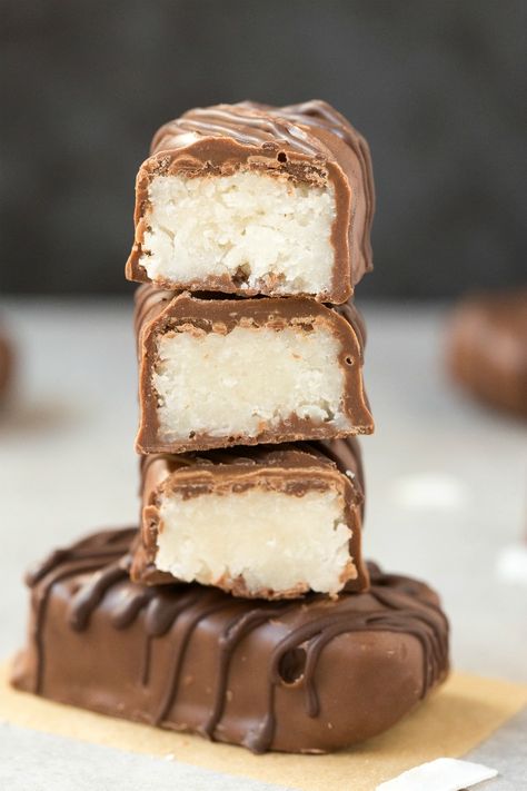 Homemade No Bake Coconut Bounty Bars (Paleo, Vegan, Keto, Sugar Free)- An easy recipe for low carb homemade bounty bars- 4 ingredients, 5 minutes and the perfect balance of coconut and chocolate! #healthyrecipe #ketodessert #ketorecipes #coconutchocolate #bounty | Recipe on thebigmansworld.com Bounty Bars, Easy Candy, 4 Ingredient Recipes, Low Carb Snack, Coconut Bars, Low Carb Dessert, Paleo Vegan, Melting Chocolate Chips, Vegan Keto