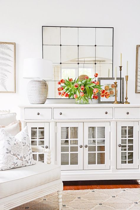 Formal Dining Room Buffet Decor, White Buffet Table Ideas Decor, How To Style A Dining Room Buffet, Side Board Styling Dining Rooms, Kitchen Buffet Decor Ideas, Buffet With Mirror Above, How To Style A Buffet Cabinet, Sideboard Under Window, Decorating A Sideboard