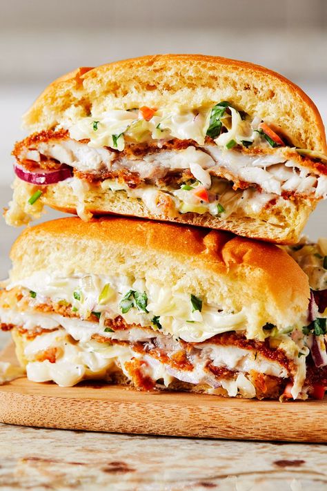 This fried catfish sandwich recipe incorporates a cumin slaw to create the ultimate seafood recipe meets comfort food.#comfortfood #seafoodrecipes #fishrecipes #friedfish #friedfishrecipes #fishsandwiches #fishsandwichrecipes #catfishrecipes Catfish Sandwich Recipes, Catfish Sandwich Sauce, Fish Fillet Sandwich Recipes, Fried Catfish Sandwich, Breaded Fish Sandwich, Frying Nemo, Catfish Sandwich, Fried Fish Sandwich, Mcdonald’s Fish Sandwich