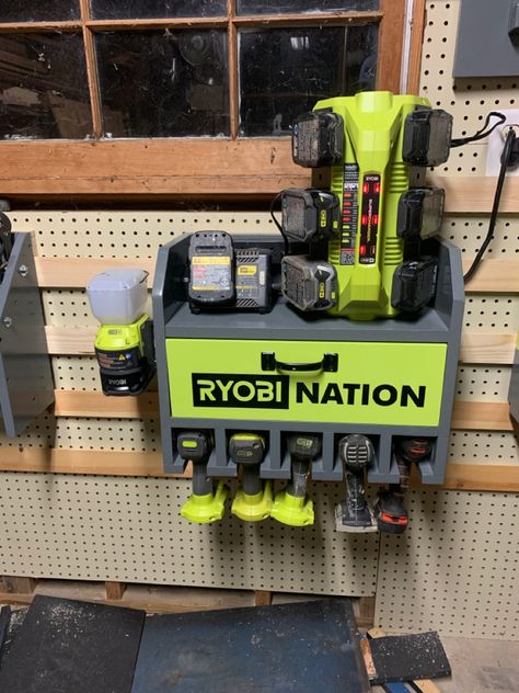 Made this out of scrap wood and used a cricut to make ryobi decal Ryobi Garage, Drill Charging Station, Ryobi Link, Charging Station Ideas, Ryobi Power Tools, Ryobi Tools, Power Tool Organizer, Garage Tool Storage, Garage Tools