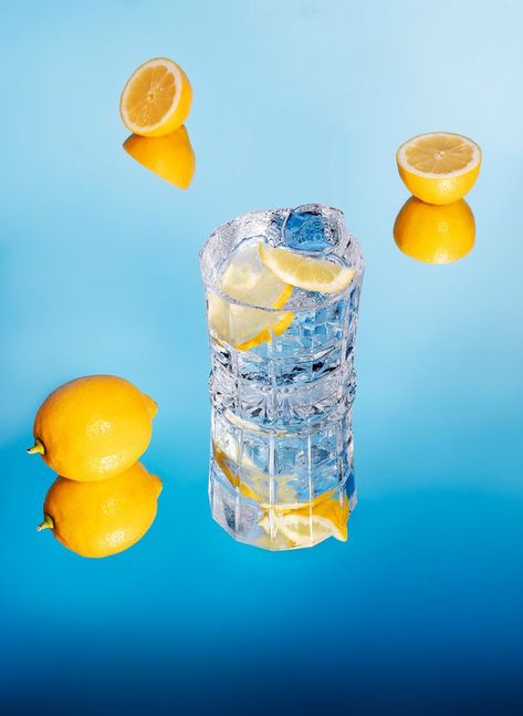 reflected food and drinks in mirrors. Blue background in contrast with the colourful food and the transparency of the liquids Mirror Product Shoot, Reflection Product Photography, Ice Product Photography, Mirror Product Photography, Water Product Photography, Food Mirror, Soda Blasting, Cocktail Pictures, Tea Website