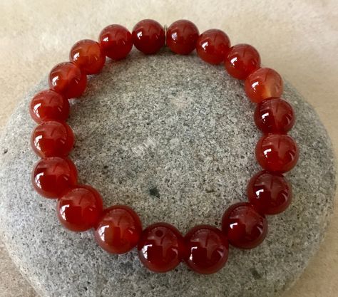 Excited to share this item from my #etsy shop: WILLPOWER - ENERGY - 10mm Carnelian Bracelet. Simple Stretch. Beaded Gemstone Bracelet. Unisex. Root/Sacral Chakra.