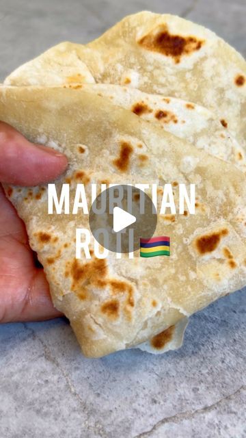 Shelina Permalloo on Instagram: "Mama Shila’s Mauritian Roti Recipe 🇲🇺 In my opinion nothing says I love you more than freshly cooked bread! I hope you enjoy, very simple but follow her steps for the perfect roti!  A few tips to remember  • when you add the oil to the flour mix it around so you almost make a shortbread, rub it into the oil with the salt until combined • add the water slowly and mix it thoroughly until the bowl is clean and rest for 30 mins  • roll out and then fold into layers and allow to rest for min of 15 minutes.  • keep moving the roti on the hot pan and brushing a bit of oil over it, don’t over cook this as it will keep the roti soft and fluffy  • finally when you remove from the heat place it into a tea towel to retain the softness   300g plain white flour  150-17 Simple Roti Recipe, Soft Roti Recipe, Pizza Muffins, Roti Recipe, Cheez It, White Flour, Pizza Bread, Plain Flour, Keep Moving