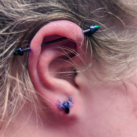 Behold the absolute splendor of this industrial piercing, featuring a Dioxizine Purple bar, complemented by black opal ends, all masterfully crafted by @MetalMafia. This isn't just any piercing - it's a statement of style and personal expression. The addition of a Titanium Spider Top and a stylish stud, also from the creative minds at @MetalMafia, elevates the look even further. Each piece has been anodized on-site to achieve the #DioxizinePurple hue, arguably the most enchanting shade of pur... Summer Glowup, Purple Bar, Shade Of Purple, Industrial Piercing, Black Opal, Shades Of Purple, Body Art, Piercings, Opal