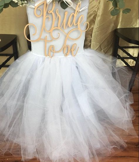 "Welcome to our family owned shop! 🌸 This gorgeous & unique tutu chiavari chair cover will add a whimsical touch to your wedding, baby shower, bridal party, birthday or event! Perfect for The bride and groom chair or the \"mama to be\" chair 💕 It has a poly-spandex top that will perfectly fit any chiavari chair and tulle material to form a full lavish tutu skirt. They are beautifully sewn together and arrive in one finished piece. We match the poly-spandex and the tulle colors. Please message Bridal Chair Cover, Bridal Shower Chair, Bridal Chair, Brides Chair, Tutu Table, Tulle Table, Bridal Shower Photos, Wedding Tablecloths, Chair Covers Wedding