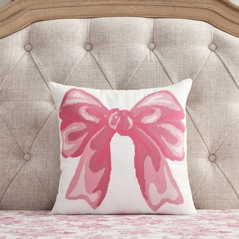 Give their space a whimsical touch with a plush pillow showcasing a large pink bow. This decor is crafted from durable cotton canvas using a needlepoint-inspired print that is sure to complement the rest of their bedding. Designed exclusively for Pottery Barn Kids by lifestyle brand LoveShackFancy. DETAILS THAT MATTER Made of 100% yarn-dyed cotton canvas. Yarn-dyed fiber has incredibly rich color that holds its vibrancy over time. Reverses to the same fabric. Fill is made of 100% recycled polyester. Features needle point-looking technique stitching detail on front of pillow. Made in a Fair Trade Certified(TM) factory, supporting fair and safe labor practices and empowering workers to invest in their communities. OEKO-TEX(R) STANDARD 100: tested for 1000+ harmful substances to keep you and Pink Blue And Gold Bedroom, Loveshackfancy Home, Pottery Barn Love Shack Fancy, Cute Couch Pillows, Pink Bow Bedroom, Loveshackfancy Bedding, Cute Pink Room Decor, Pink And Gold Room Decor, Preppy Throw Pillows