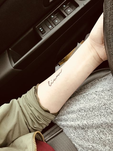 #liam #tattoo #arm #forearm #wrist #lettering #words #simple #cute #son #baby #name #tattoos Liam Tattoo, Sons Name Tattoos, Tattoos For Baby Boy, Baby Memorial Tattoos, Lettering Words, Baby Tattoo Designs, Kid Name Tattoo, Tiny Heart Tattoos, Names Tattoos For Men