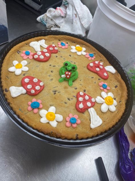 Mother’s Day Heart Cookie Cake, Frog Cookie Cake, Cookie Cake Frosting Designs, Walmart Cakes Designs, Square Cookie Cake Decorating Ideas, Birthday Cake Neutral, Cookie Cake Ideas Decorated, Cute Cookie Cake Designs Birthday, Big Cookie Decorating Ideas