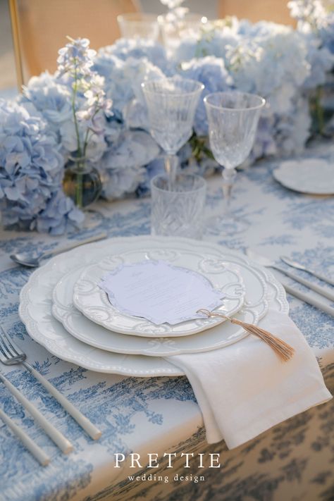 Luxury Blue And White Wedding Table Ideas With Wedding Menu Cards |Explore Alyssa & Marcelo's breathtaking luxury destination wedding at Palácio Nacional de Queluz, Portugal, featuring elegant wedding stationery design with unique wedding aesthetic. Discover wedding menu cards and wedding table decorations. Elevate your dream wedding with Prettie Wedding Design. Get in touch now at prettie.pt to create your elegant wedding invitation & day of wedding stationery. French Blue Wedding, Chinoiserie Wedding, Blue Table Settings, Stationery Aesthetic, Blue White Weddings, Enchanting Wedding, Blue Bridal Shower, Light Blue Wedding, Blue Hydrangeas