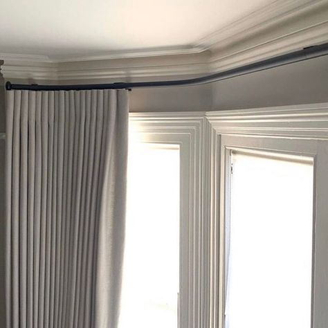 Bay windows can often be tricky when it comes to window treatments. A bespoke bending service gives you the option to apply a curtain pole to the window.  Bradley Collection Gliderpole, custom bent for this bay, with Pebble finials and a bespoke finish. #trickywindow #baywindow #curtainpole Bay Window Curtains Bedroom, Bay Window Bedroom, Bay Window Curtain Poles, Ripplefold Curtains, Bay Window Treatments, Bay Window Living Room, Kitchen Bay Window, Wooden Curtain Poles, Bay Window Curtain