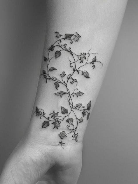 Vines Tattoo, Wrap Around Wrist Tattoos, Daisy Tattoo Designs, Butterfly With Flowers Tattoo, Wrap Around Tattoo, Body Tattoo Design, Black Bird Tattoo, Wrap Tattoo, Saved Tattoo