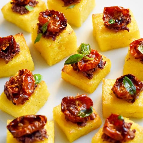 Up your vegan canapé game with these crispy polenta bites. They're packed full of flavour, easy to make and are a hit with every dinner guest. Winning combination for an easy vegan appetiser. } Polenta Squares, Polenta Appetizer, Polenta Bites, Crispy Polenta, Grilled Polenta, How To Cook Polenta, Party Bites, Slow Roasted Tomatoes, Peanut Dipping Sauces