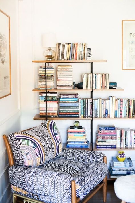 This stylish small reading chair pairs with industrial bookshelves to make a lovely book nook. More corner reading chair ideas in this list! Living Room Book Nook Ideas, Reading Corner Bookshelf, Tall Bookcase Living Room, Organized Bookshelves, Whale Bookends, Bookshelf Goals, Books On Shelves, Fun Chair, Bohemian Chair