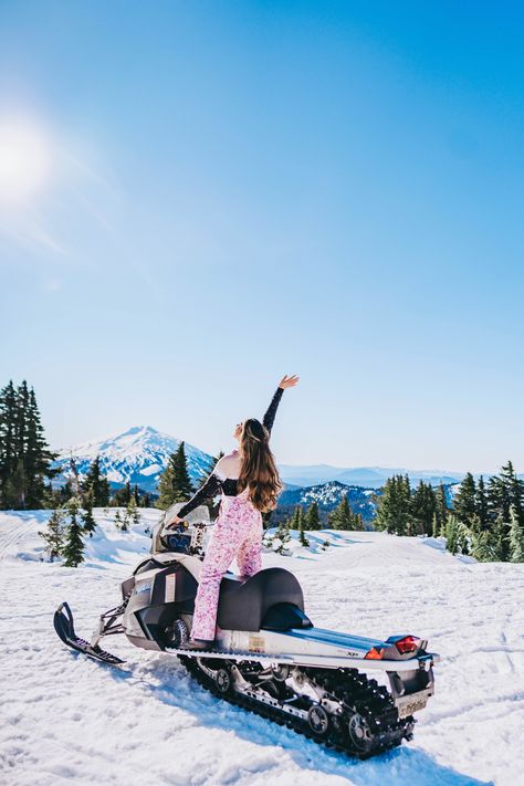 Woman with long brunette hair puts her hand up in the air as she does winter activities in Bend, Oregon Snowmobile Instagram Pictures, Snowmobile Picture Ideas, Snow Mobile Pictures, Snowmobile Photoshoot, Girls Snow Trip, Snowmobiling Outfit, Snowmobile Aesthetic, Pictures In Snow, Snowmobiling Girl