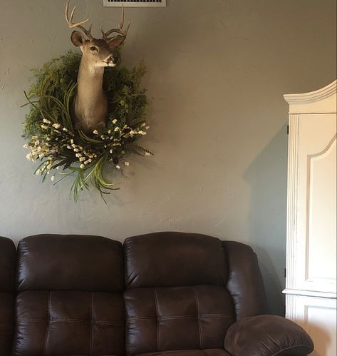 Added a wreath to husband’s deer head #deermount #husbandsdeerhead #taxidermy #wreath #deermountwithwreath #deermountdecor #deerheaddecor Office With Deer Mounts, Wreath Around Deer Mount, Boho Deer Head, Deer Head Above Fireplace, Gallery Wall With Deer Mount, Tasteful Taxidermy Decor, Decorating With Taxidermy, Deer Mount Wall Arrangement, Dear Head Decor