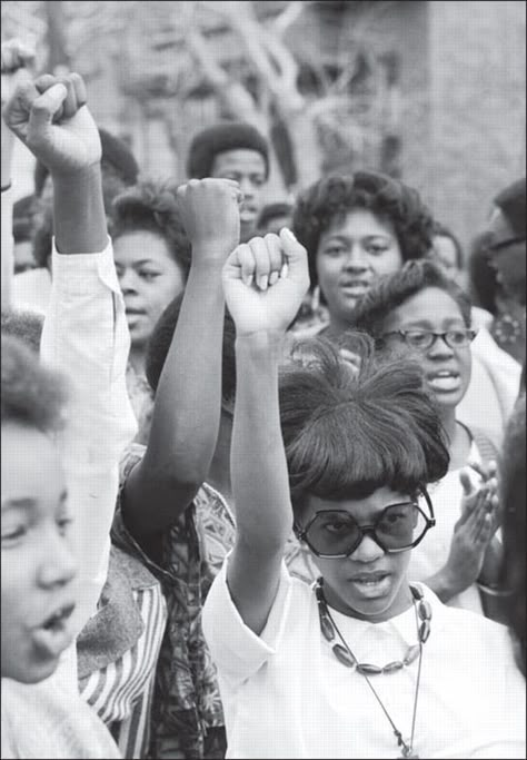 A group of young black women raise their fists in a black power salute.  Photo credit: Getty  Does anyone know when this photo was taken, who the photographer was, and where it was taken? Black Power Salute, Black Panther Party, Civil Rights Movement, Power To The People, Black Pride, African American Women, African American History, Black American, Black Power