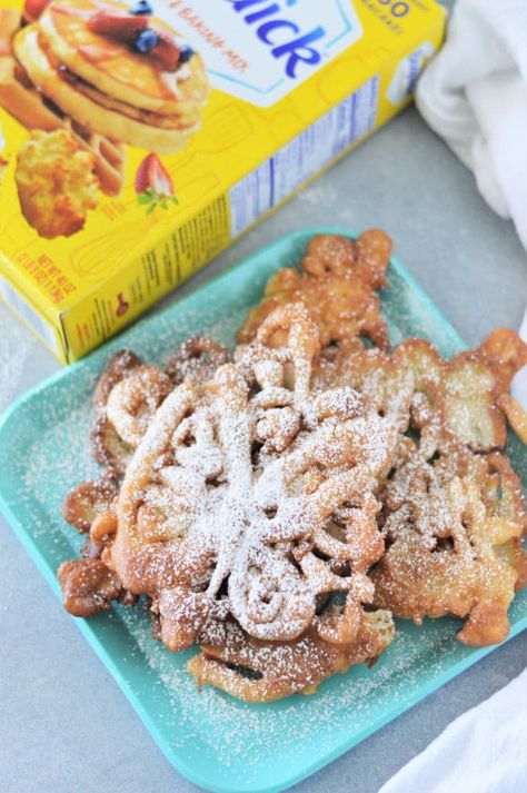 3 ingredient Bisquick funnel cake is easy to make for breakfast or dessert. How to make this fun fair food right at home with your kids. Bisquick Funnel Cake, Funnel Cake With Bisquick Recipe, Funnel Cake Recipe Easy Bisquick, Funnel Cake With Pancake Mix Recipe, Bisquick Donuts Fried, Funnel Cake Recipe With Pancake Mix Easy, Bisquick Funnel Cake Recipe, Pancake Mix Funnel Cake, Funnel Cake Recipe Easy