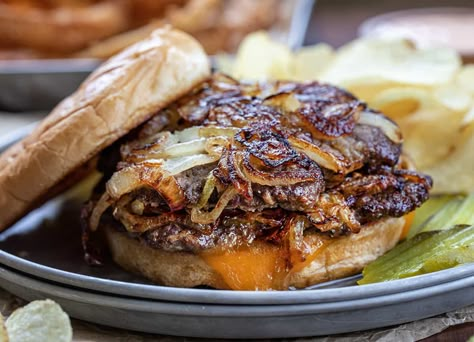 An Oklahoma Fried Onion Burger is two beef patties smashed down onto piles of fried onions and topped with cheese, on a toasted hamburger bun. Oklahoma Fried Onion Burger, Oklahoma Onion Burger, Sandwich Station, Baked Meals, Onion Burgers, Bbq Meats, Onion Burger, Bbq Dishes, Beef Patties