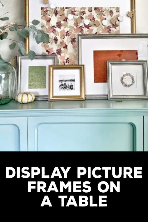 How to Display Picture Frames on a Table Photo Frames On Sideboard, Frames On Table Display, Photo Display On Table, Table With Framed Photos, How To Style Picture Frames On Table, Tabletop Photo Display Ideas, How To Display Family Photos On Tables, Picture Frame Display On Table, Photo Table Display